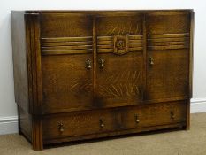 Early 20th century medium oak sideboard, three cupboard doors, carved rose detail, two long drawers,