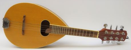Flat-back eight string mandolin