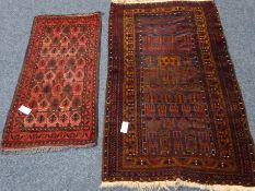 20th century brown ground prayer rug (80cm x 142cm) and a Turkish style red ground rug (53cm x