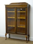 Early 20th century oak bookcase, raised shaped back, moulded top,
