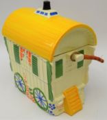 Biscuit jar and cover in the form of a caravan with cane swing handle,