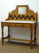 Early 20th century walnut wash stand, raised shaped mirrored back with tiles above marble top,