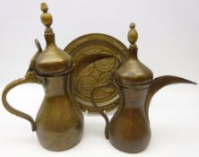 Two early 20th century Eastern brass Dallahs' both with impressed makers mark,