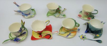 Seven Franz sculptured porcelain cup, saucer & spoon sets comprising Blossom-Rose, Peacock,
