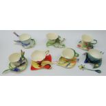 Seven Franz sculptured porcelain cup, saucer & spoon sets comprising Blossom-Rose, Peacock,