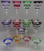 Set of twelve Bohemian Harlequin overlay flash cut claret glasses on tall faceted stems and a set