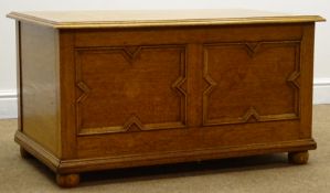 Early 20th century medium oak chest, hinged lid, geometric pattern, bun supports, W92cm, H49cm,