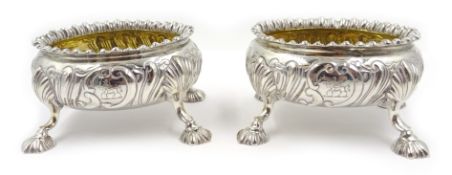 Pair of early Victorian silver salts, gadrooned borders, embossed scroll decoration, gilt interiors,