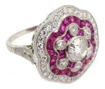 Large platinum (tested) ruby and diamond flower head ring,