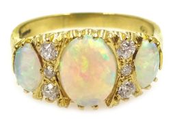 18ct gold three stone opal and six stone diamond ring,