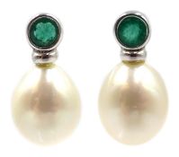 Pair of white gold pearl and emerald earrings, stamped 9ct Condition Report Approx 3.