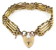 Gold four bar gate bracelet, with heart locket clasp, stamped 9ct, approx 20.