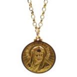 18ct gold Middle Eastern medallion cast with religious portraits and script,