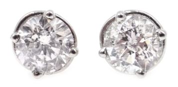 Pair of white gold diamond stud earrings, stamped 14K, diamonds approx 1.