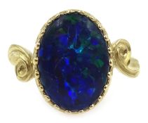 9ct gold oval opal triplet ring with scroll design shoulders,