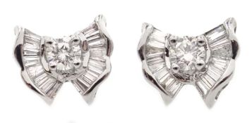 Pair of 18ct white gold round and baguette diamond bow stud earrings,