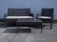 Two seat rattan sofa and armchair with matching coffee table Condition Report