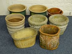 Collection of ten pots and planters, a chimney pot, two metal watering cans,
