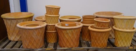 Twenty nine terracotta plant pots and platers,