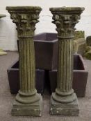 Pair stone effect Corinthian style pedestal stands, acanthus leaf capitals on fluted columns,