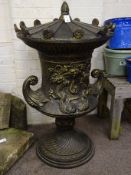 Large bronze finish cast iron lidded garden urn, decorated with foliage swags and dolphins,
