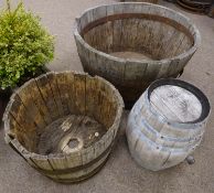 Large oak and metal bound half barrel planter (D94cm, H57cm),