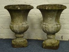 Pair composite stone urn planters, circular form with egg and dart rim and gadroon underside, D46cm,