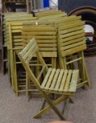 Set of twelve green stained folding garden chairs,