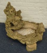 Composite stone water feature depicting a forest scene with otters and squirels,