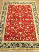 Kashan red ground rug, blue floral repeating border,