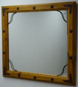 Large rectangular pine framed mirror with metal strapping and stud, W103cm,