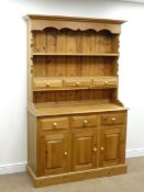 Pine dresser, projecting cornice, shaped frieze, two plate rack shelves, six drawers,