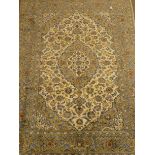 Keshan beige and blue ground rug, central medallion, floral field, repeating border,
