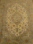 Keshan beige and blue ground rug, central medallion, floral field, repeating border,