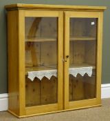 Small 19th century pine wall cabinet, projecting cornice, two glazed doors enclosing two shelves,