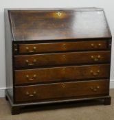 Early 19th century oak bureau, fall front enclosing fitted interior,
