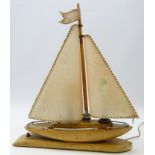 Art Deco table lamp modelled as a yacht with vellum sail & chrome mounts on oak base,
