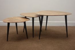 Set of three Retro occasional tables, shaped tops on ebonised supports H45cm, D65cm,