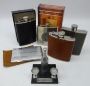 Art Deco table lighter in the form of a Champagne bottle with two Champagne bowls as ashtrays,