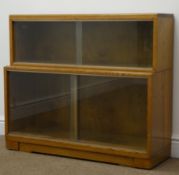 Mid 20th century oak stepped library style bookcase, two compartments with sliding glazed doors,