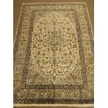 Kashan beige ground rug, central medallion, floral field and repeating border,