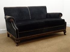 Early 20th century walnut framed traditional two seat sofa, upholstered in dark green fabric,