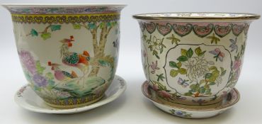 Two Chinese platers on stands both decorated with polychrome enamels,