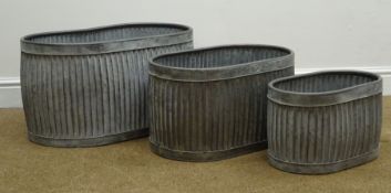 Three galvanized metal oval graduating dolly tub type planters, W38cm,