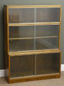Mid 20th century oak stepped library style bookcase, three compartments with sliding glazed doors,