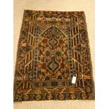 Old Baluchi brown ground rug, 121cm x 88cm Condition Report <a href='//www.