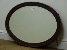 Oval mahogany framed bevel edge mirror, W80cm,