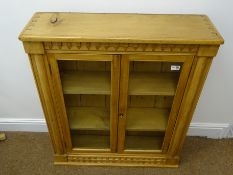 Early 20th century solid pine bookcase, projecting cornice, two glazed doors enclosing two shelves,