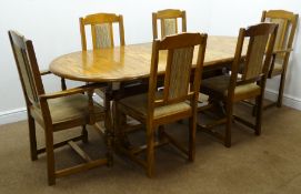 Oval oak finish extending refectory table,