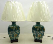 Pair Oriental style table lamps decorated with butterflies amongst foliage on turquoise ground on